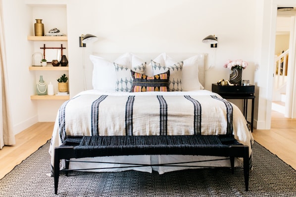 Downstairs master bedroom with king bed, walk in closet and private bathroom