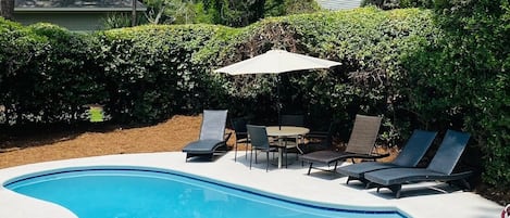 Plenty of seating and sunshine at our private pool