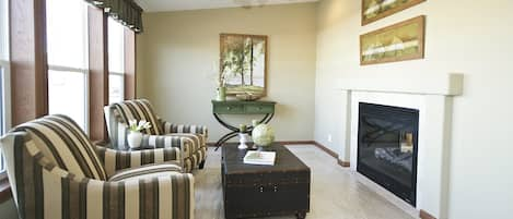 Sunroom overlooking the lake with double fireplace