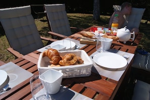 enjoying an outdoor breakfast in sunny weather