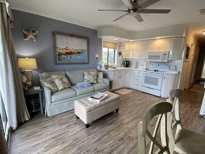 Living/kitchen area   Clean, bright and airy with the extra windows