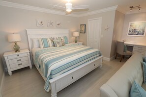 Bedroom with king size bed with storage drawers. 