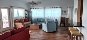 Large living room with panoramic views of the beach and room for everyone!
