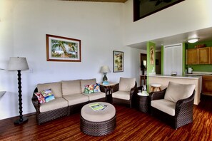 Living room is furnished with outdoor furniture.