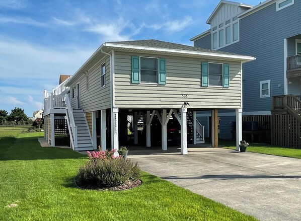 Front of House with new lawn and garden