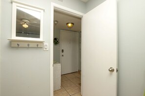 From the bedroom, you are looking at the entry foyer and door to condo.