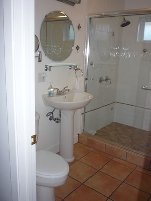 Tiled bathroom and shower.