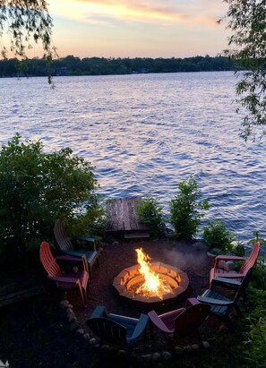 Enjoy the private fire pit and fishing pier with views of lake and sunset
