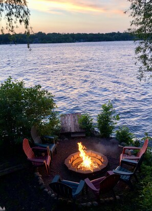 Enjoy the private fire pit and fishing pier with views of lake and sunset