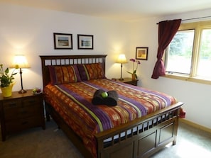 bedroom with queen size bed and attached bathroom
