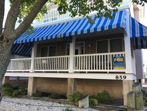 HUGE porch on wide quiet street.  Brand new awnings for privacy & shade.