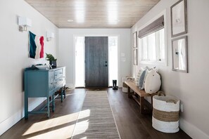 Foyer with direct garage access and adjoining mudroom 