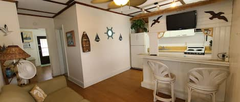 Panoramic view of kitchen and living room from front door