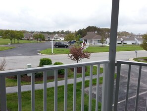 Front porch with club house, pool and fitness center right across the street