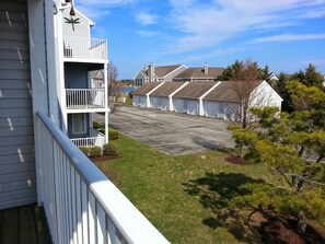 View left side of back porch. Can see the bay in the distance.