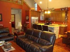 Great room looking toward kitchen/stairs/bedrooms.