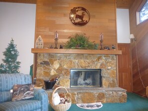 Large stone fireplace; entrance to master through door on the right (accessible)