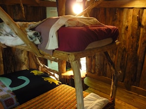 Three single beds on second floor of Hermit-Thrush treehouse