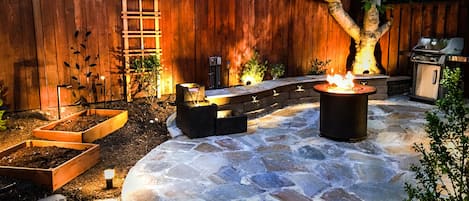 Heavenly private patio with grill, firepit, and a soothing water fountain.