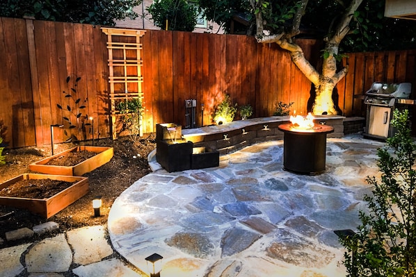 Heavenly private patio with grill, firepit, and a soothing water fountain.