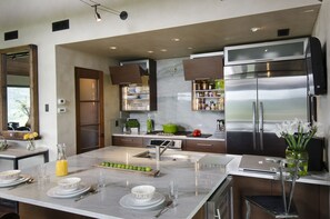 Gourmet Kitchen w/motorized cabinet doors.