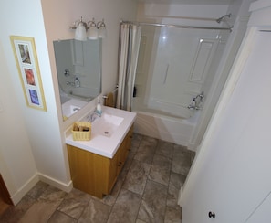 Large bathroom with heated floors and laundry.