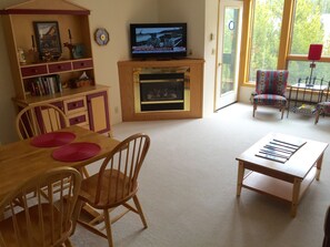 Cozy dining area, gas fireplace and satellite Smart TV