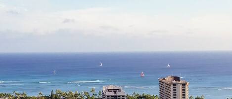 view of sail boats off Waikiki beach from window