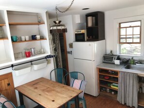Kitchen island, looking toward fridge and pantry