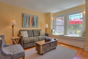 Living room - lots of seating to relax, including the charming window seat