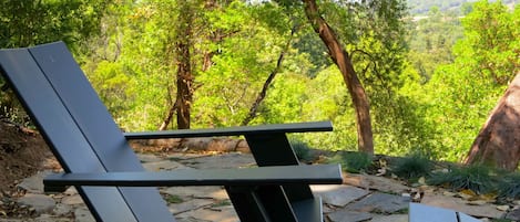 Seating area on the patio up behind the house. Stunning views & deep tranquility