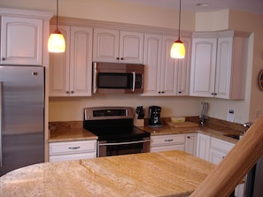 Walk in to your open concept modern kitchen.  Includes the necessities.