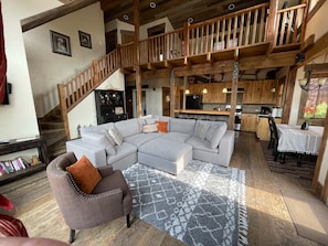 Living room with kitchen and open loft above, 8/28/22