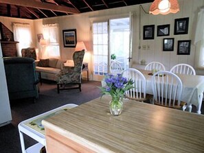 Looking from the kitchen to the eating area and living room. 