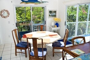 Dining Room, sliders to the deck overlooking pool & steps  to roofdeck & to pool