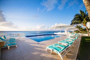 Where sky, ocean and pool merge as one before you.