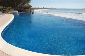 OUR HUGE INFINITY POOL IS TRULY RIGHT ON THE BEACH!