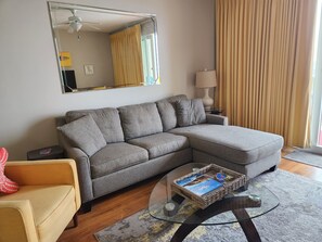Living room with sleeper sofa.  Mattress is upgraded to comfortable memory foam