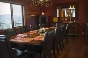 Large dining room table that can fit up to 14 people comfortably using foldouts.