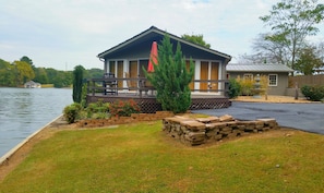 View from driveway and fire pit area...Completely flat entryway shown near right