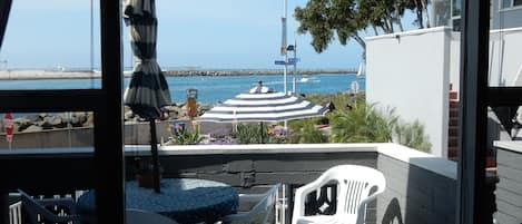 Beautiful ocean view from living room and outdoor patio seating.