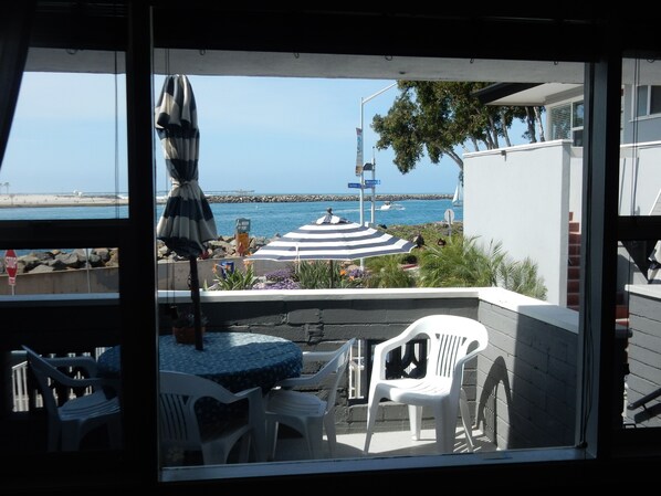 Beautiful ocean view from living room and outdoor patio seating.