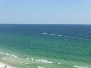 Emerald green water views from the balcony and floor to ceiling windows