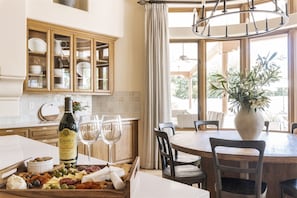 Warm, bright and inviting chef's kitchen with extra large dining table for 8.