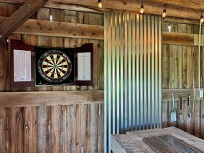Fire up the charcoal BBQ pit and enjoy a friendly game of darts!