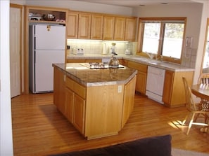 The kitchen is well-equipped, includes a nice size pantry for food storage.