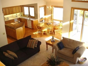 View of open floor plan -- kitchen, dining and living rooms