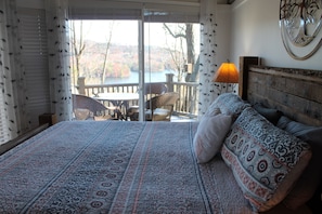 Master bedroom looks over lake with mountains as a back drop. GORGEOUS sunrises