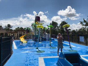 Kids water park with two water slides and bucket