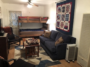 Living room with twin bunks and full sized sleeper sofa